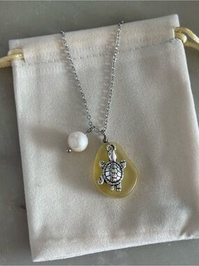 Silver Turtle Pendant Necklace with Yellow Stone and Pearl Accent